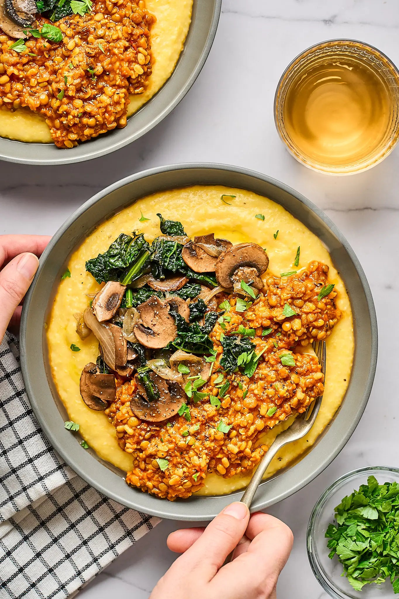 A serving of Trinity Mix tomato-braised lentils with cheesy polenta
